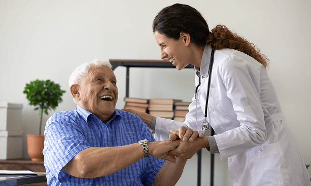 old man laughing with doctor